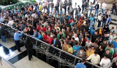 Attendees queuing for translation headphones